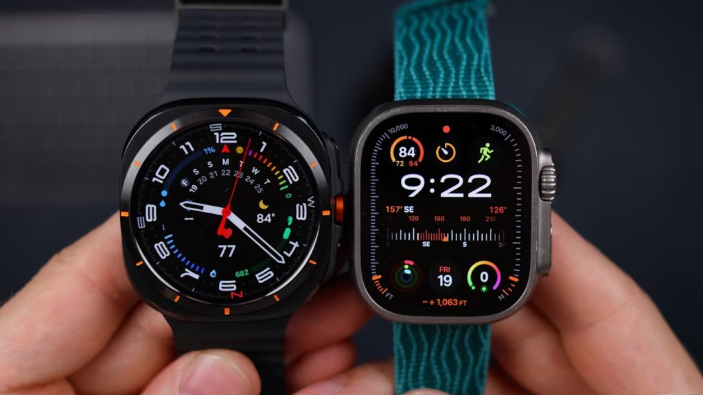 Hand holding two health trackers side by side to compare and collect different body data
